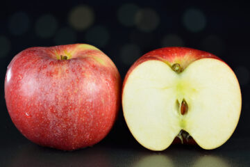 Royal Gala apple whole and halved